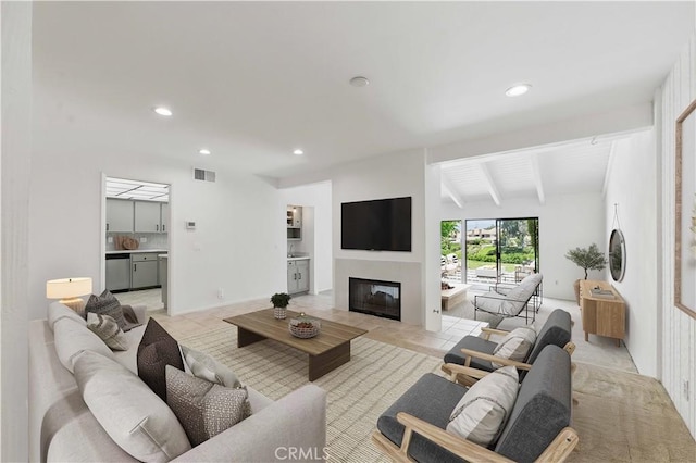4424 Park Jazmin, Calabasas, CA 91302 - living room featuring a glass covered fireplace, recessed lighting, and light tile patterned floors