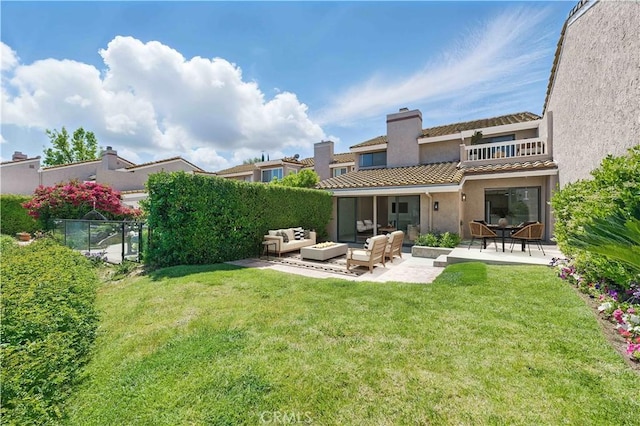 4424 Park Jazmin, Calabasas, CA 91302 - back of property with an outdoor hangout area, a patio area, stucco siding, a chimney, and a tile roof