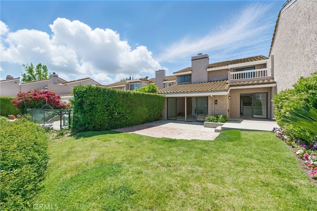 4424 Park Jazmin, Calabasas, CA 91302 - back of house featuring a patio, stucco siding, a chimney, a tiled roof, and a balcony