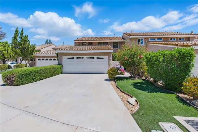 4424 Park Jazmin, Calabasas, CA 91302 - view of front of property with stucco siding, driveway, an attached garage, a front yard, and a tile roof