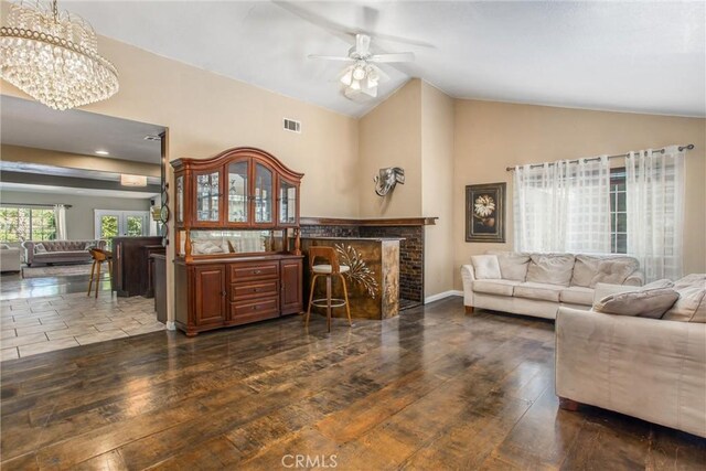 11425 Bryant St, Yucaipa, CA 92399 - living area featuring ceiling fan, hardwood / wood-style floors, a chandelier, high vaulted ceiling, and baseboards