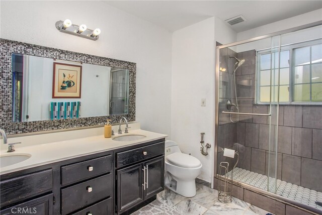 11425 Bryant St, Yucaipa, CA 92399 - bathroom featuring toilet, a shower stall, double vanity, and marble look tiles