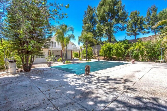 11425 Bryant St, Yucaipa, CA 92399 - view of pool featuring a patio and a covered pool