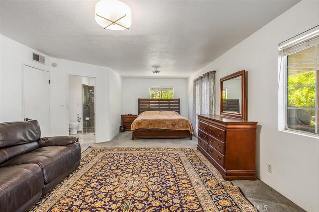 11425 Bryant St, Yucaipa, CA 92399 - bedroom featuring light colored carpet and ensuite bathroom