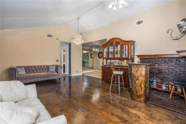 11425 Bryant St, Yucaipa, CA 92399 - living room with hardwood / wood-style floors, lofted ceiling, ceiling fan, a chandelier, and bar area