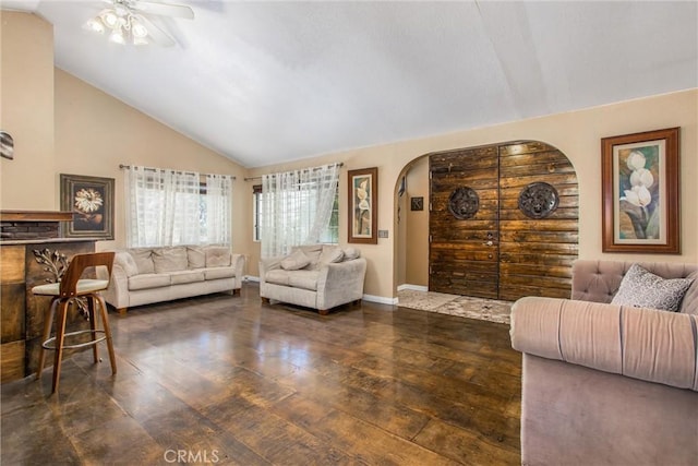 11425 Bryant St, Yucaipa, CA 92399 - living area featuring arched walkways, wood-type flooring, lofted ceiling, ceiling fan, and baseboards