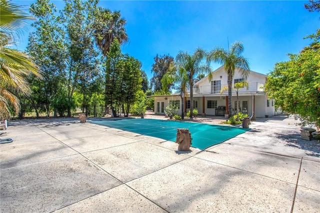 11425 Bryant St, Yucaipa, CA 92399 - view of swimming pool with a covered pool and a patio