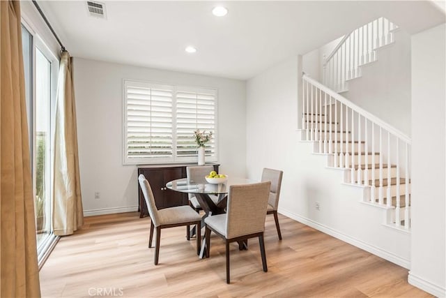 23911 Brio Ct, Valencia, CA 91354 - dining room with wood finished floors, stairs, baseboards, and recessed lighting