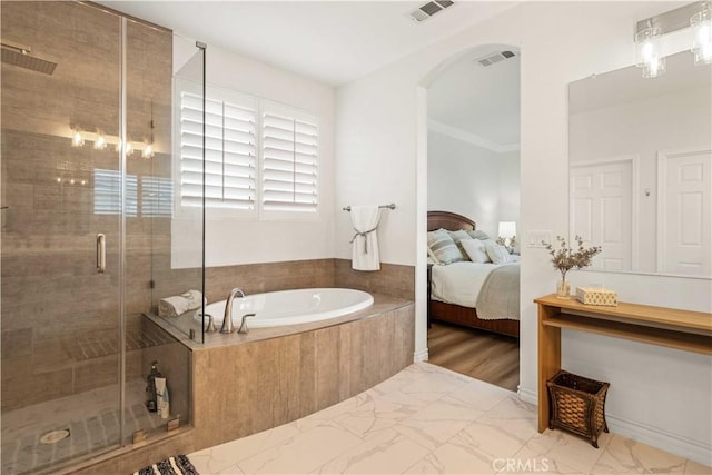 23911 Brio Ct, Valencia, CA 91354 - ensuite bathroom with a garden tub, a shower stall, and marble look tile flooring