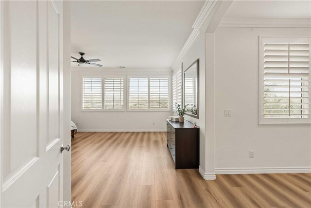 23911 Brio Ct, Valencia, CA 91354 - spare room featuring light wood-style floors, healthy amount of natural light, crown molding, a ceiling fan, and baseboards