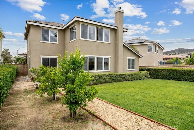 23911 Brio Ct, Valencia, CA 91354 - rear view of property with stucco siding, a chimney, and a tile roof