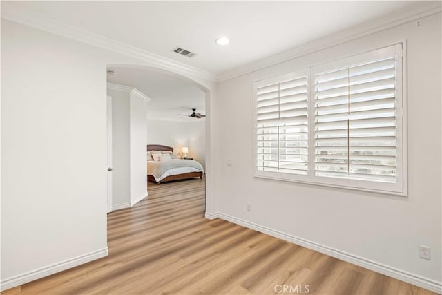 23911 Brio Ct, Valencia, CA 91354 - empty room featuring crown molding, arched walkways, light wood-type flooring, baseboards, and recessed lighting