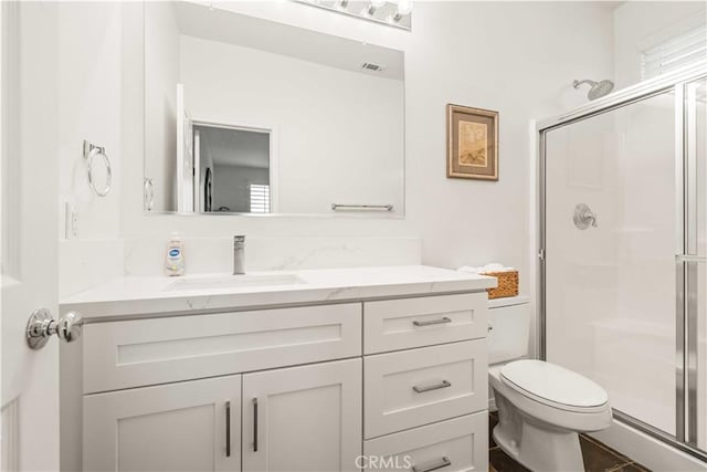 23911 Brio Ct, Valencia, CA 91354 - bathroom with a shower stall, vanity, and toilet