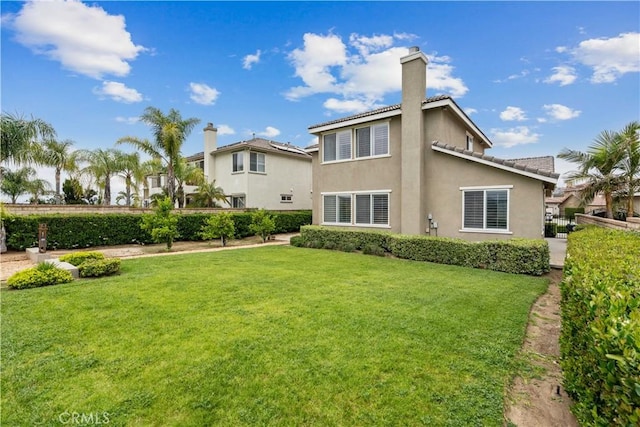 23911 Brio Ct, Valencia, CA 91354 - back of house featuring a chimney and stucco siding