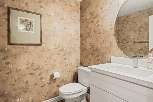 23911 Brio Ct, Valencia, CA 91354 - half bathroom with wallpapered walls, toilet, and vanity