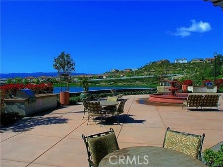 23911 Brio Ct, Valencia, CA 91354 - view of patio featuring outdoor dining space and exterior kitchen