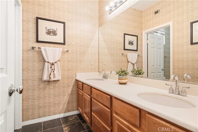 23911 Brio Ct, Valencia, CA 91354 - full bath with marble finish flooring, baseboards, double vanity, and wallpapered walls