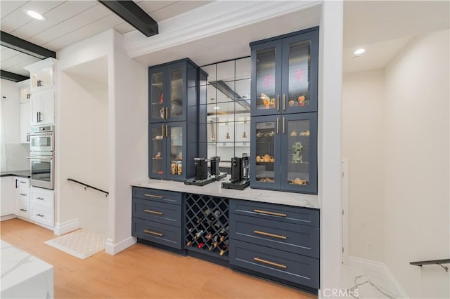 451 Avenida Esplendor, Walnut, CA 91789 - indoor bar featuring beamed ceiling, stainless steel double oven, baseboards, light wood finished floors, and recessed lighting