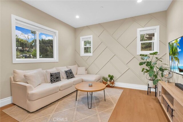 451 Avenida Esplendor, Walnut, CA 91789 - living room featuring baseboards, light wood-style flooring, recessed lighting, and a decorative wall