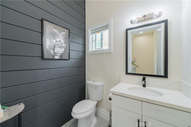 451 Avenida Esplendor, Walnut, CA 91789 - half bathroom with vanity, toilet, tile patterned floors, and wood walls