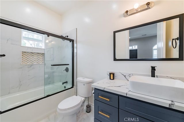 451 Avenida Esplendor, Walnut, CA 91789 - bathroom featuring marble finish flooring, bath / shower combo with glass door, vanity, and toilet