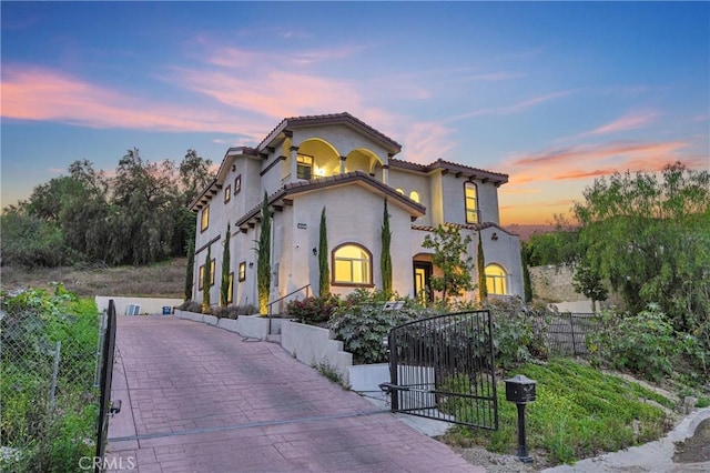 451 Avenida Esplendor, Walnut, CA 91789 - mediterranean / spanish home featuring a gate, stucco siding, and a tile roof