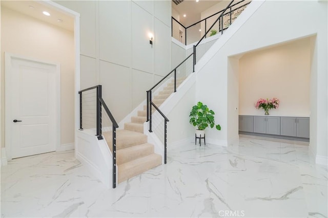 451 Avenida Esplendor, Walnut, CA 91789 - stairway featuring marble tiled floors, a high ceiling, recessed lighting, and baseboards
