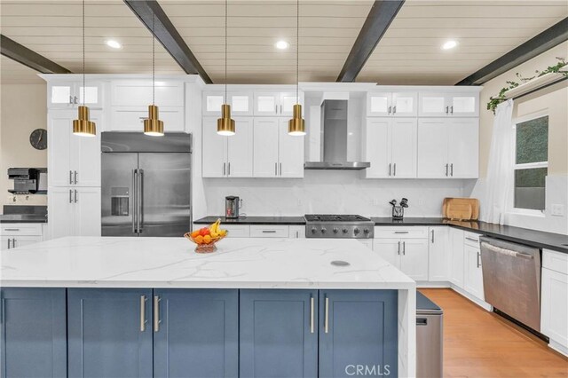 451 Avenida Esplendor, Walnut, CA 91789 - kitchen featuring appliances with stainless steel finishes, wall chimney exhaust hood, white cabinets, glass insert cabinets, and wooden ceiling with exposed beams