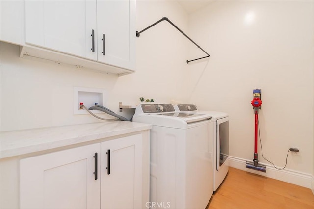 451 Avenida Esplendor, Walnut, CA 91789 - washroom featuring cabinet space, washing machine and dryer, light wood-style floors, and baseboards