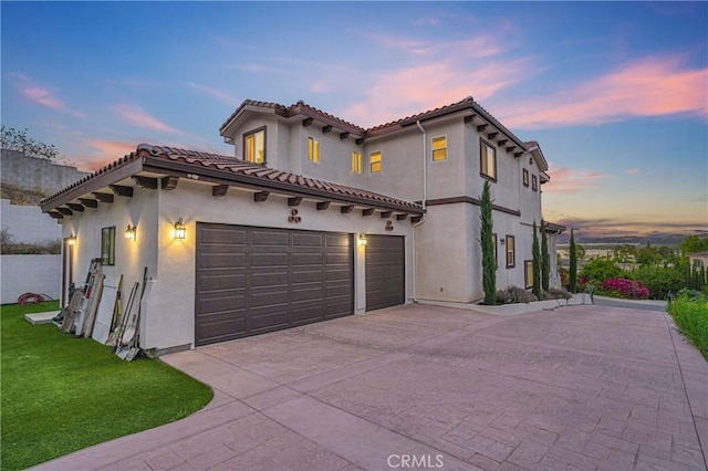 451 Avenida Esplendor, Walnut, CA 91789 - mediterranean / spanish-style home with concrete driveway, stucco siding, a tiled roof, a yard, and a garage