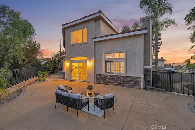 338 Calle Vis, Walnut, CA 91789 - rear view of property featuring a patio, stucco siding, stone siding, and a tile roof