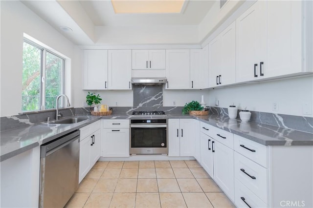 338 Calle Vis, Walnut, CA 91789 - kitchen featuring appliances with stainless steel finishes, white cabinetry, under cabinet range hood, and light tile patterned floors