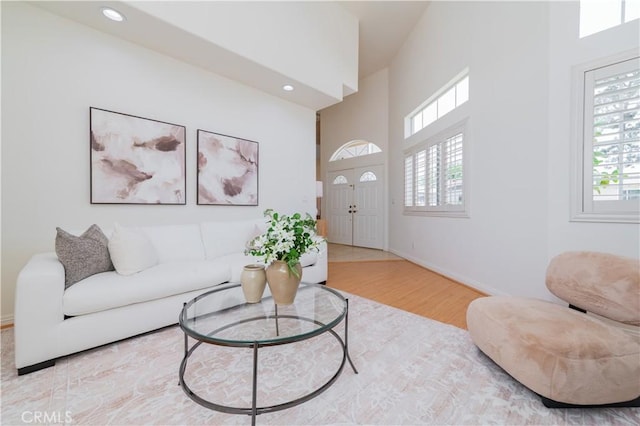 338 Calle Vis, Walnut, CA 91789 - living area featuring plenty of natural light, wood finished floors, a high ceiling, and recessed lighting