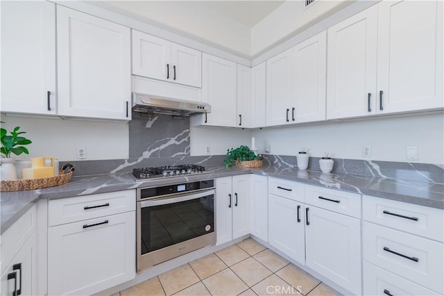 338 Calle Vis, Walnut, CA 91789 - kitchen featuring appliances with stainless steel finishes, white cabinets, light tile patterned flooring, and extractor fan