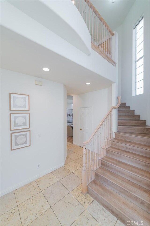 338 Calle Vis, Walnut, CA 91789 - staircase featuring tile patterned floors, recessed lighting, and a high ceiling