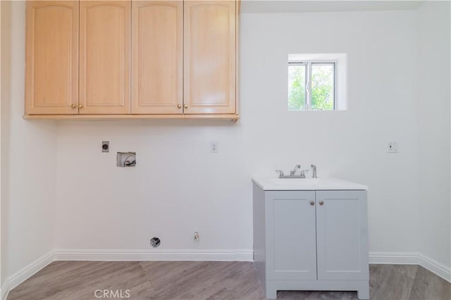 338 Calle Vis, Walnut, CA 91789 - laundry room featuring hookup for a gas dryer, electric dryer hookup, light wood-style floors, and cabinet space