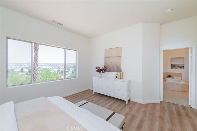 338 Calle Vis, Walnut, CA 91789 - bedroom with light wood-type flooring and ensuite bath