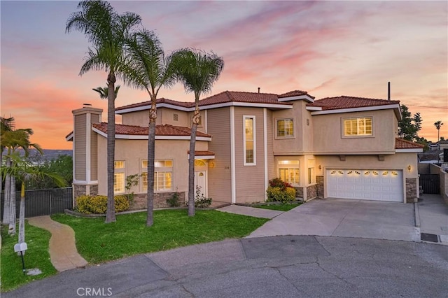 338 Calle Vis, Walnut, CA 91789 - view of front of property featuring stone siding, concrete driveway, a garage, and stucco siding