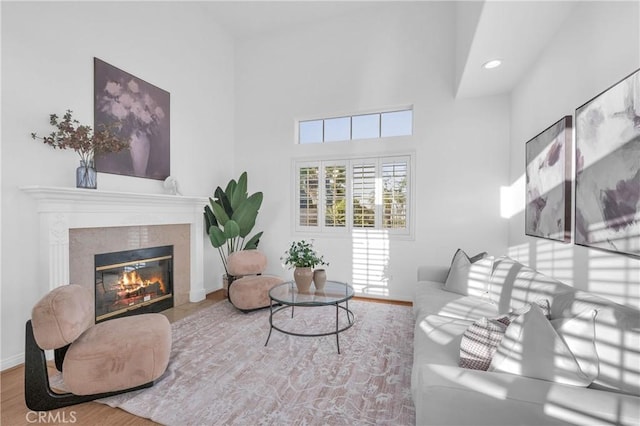 338 Calle Vis, Walnut, CA 91789 - living room with a high end fireplace, a high ceiling, wood finished floors, and recessed lighting