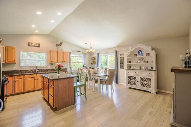 3263 Green Canyon Rd, Fallbrook, CA 92028 - kitchen with a chandelier, plenty of natural light, vaulted ceiling, a center island, and light wood-style flooring