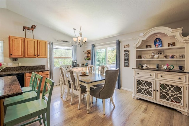 3263 Green Canyon Rd, Fallbrook, CA 92028 - dining area featuring a chandelier, vaulted ceiling, light wood-style floors, and baseboards