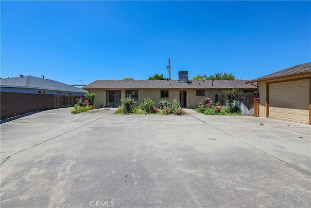 442 R St, Merced, CA 95341 - ranch-style house with central AC unit, a garage, and driveway