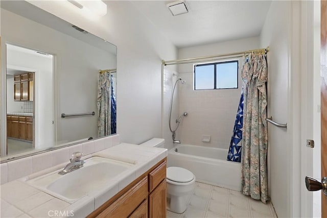442 R St, Merced, CA 95341 - bathroom featuring toilet, shower / bath combination with curtain, tile patterned floors, and vanity