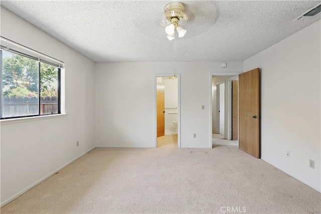 442 R St, Merced, CA 95341 - unfurnished bedroom with carpet flooring, a textured ceiling, and ensuite bathroom