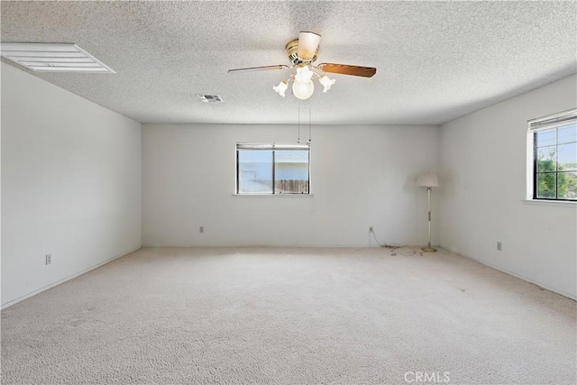 442 R St, Merced, CA 95341 - carpeted empty room featuring a textured ceiling and a ceiling fan