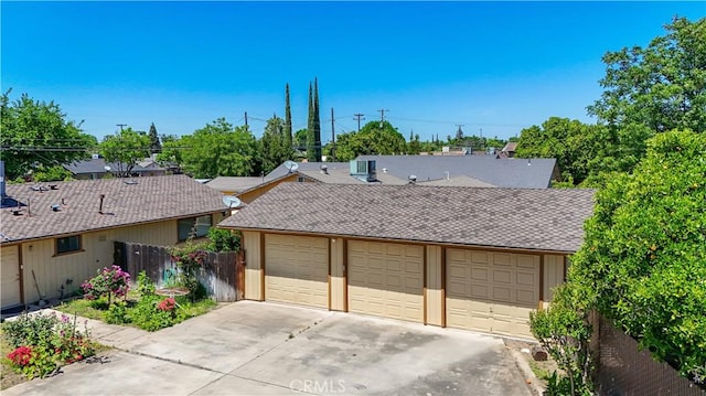442 R St, Merced, CA 95341 - view of front facade featuring a garage, central AC, and roof with shingles