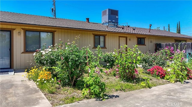 442 R St, Merced, CA 95341 - view of side of property with roof with shingles and central air condition unit