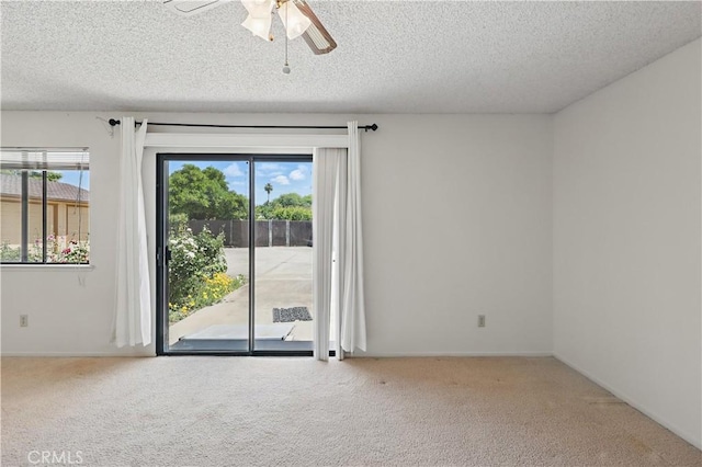 442 R St, Merced, CA 95341 - carpeted empty room featuring a textured ceiling and a ceiling fan