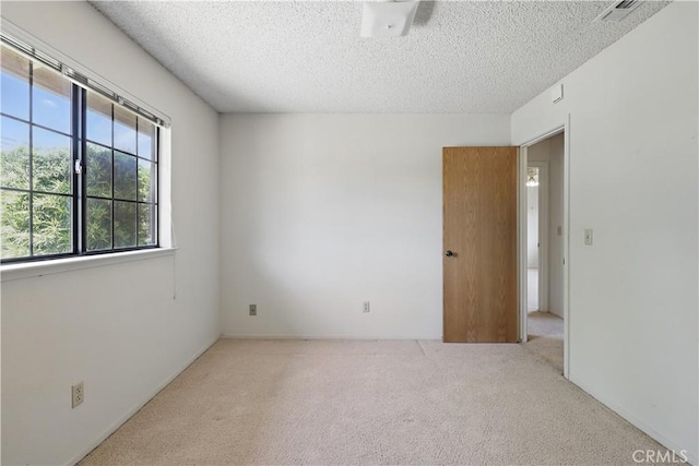 442 R St, Merced, CA 95341 - carpeted spare room featuring a textured ceiling