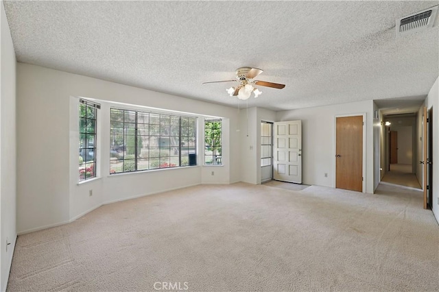 442 R St, Merced, CA 95341 - unfurnished bedroom featuring carpet, a textured ceiling, ceiling fan, and baseboards